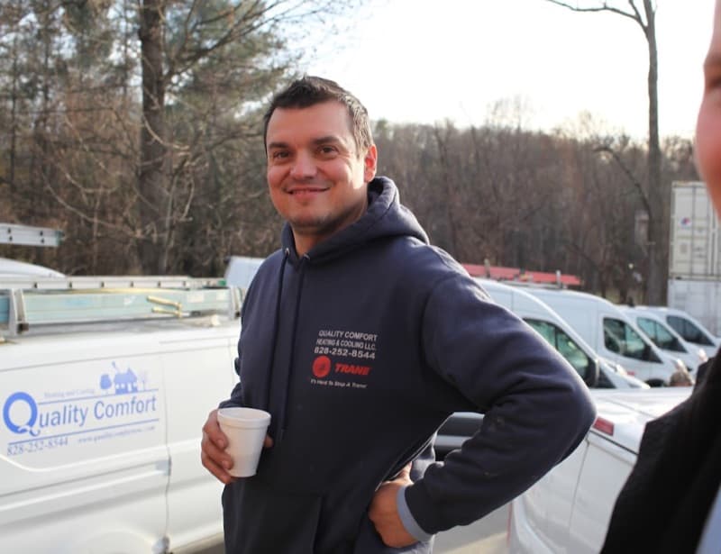 Steady Flame Fireplaces technician with coffee by service vans