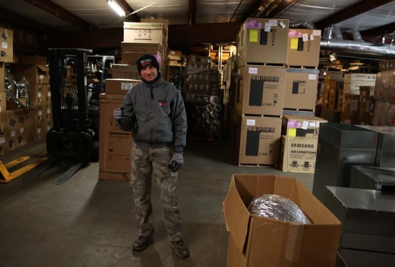 Steady Flame Fireplaces team member in the warehouse